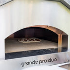 Cooking a pizza inside the hybrid gas and wood pizza oven from Italia | Grande Pro Duo ItaliaForno